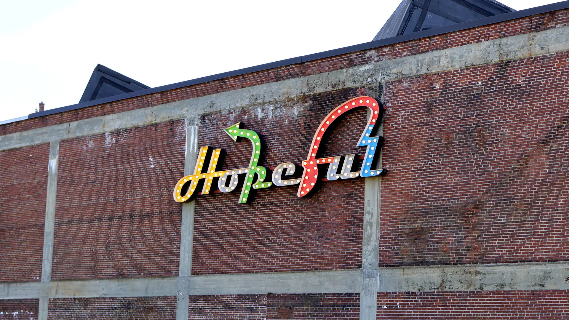 Hopeful by Charlie Hewitt, even more symbolic on the wall of Bates Mill No. 5, Lewiston, ME