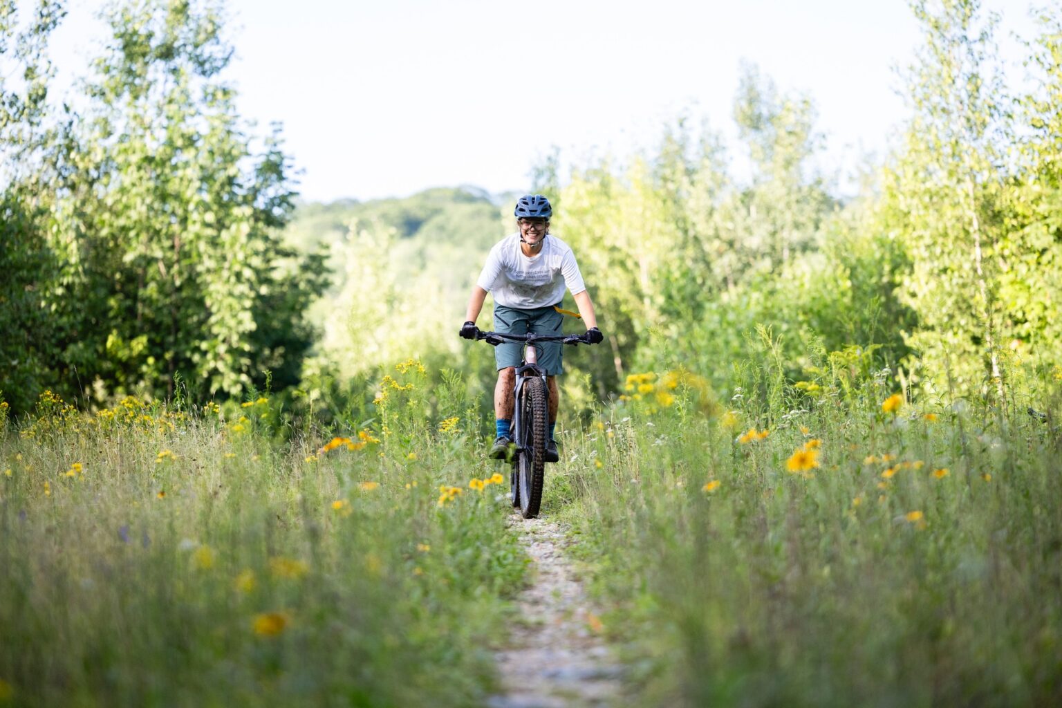 Biking on Mahoosuc Land Trust trails near Bethel