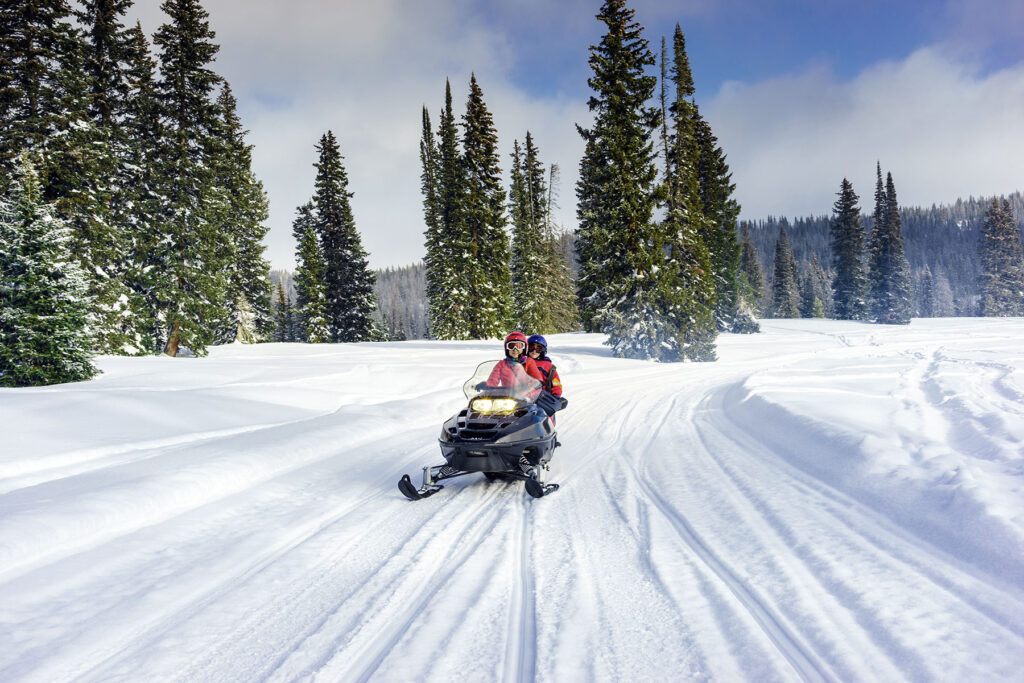 Snowmobiling along Shared-Use Trails in Maine's Lakes and Mountains