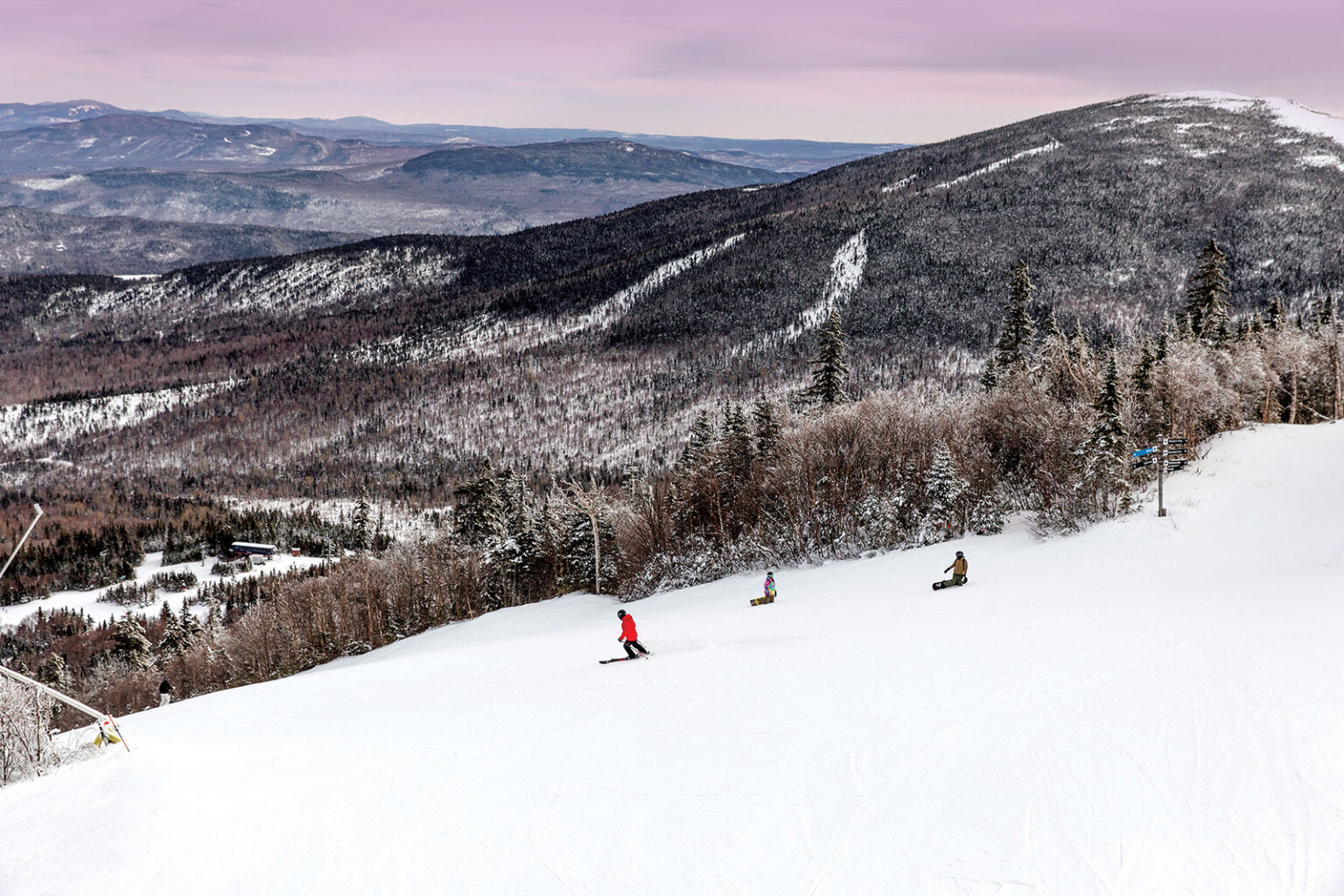 Snowboarding on the slopes in Maine's Lakes and Mountains